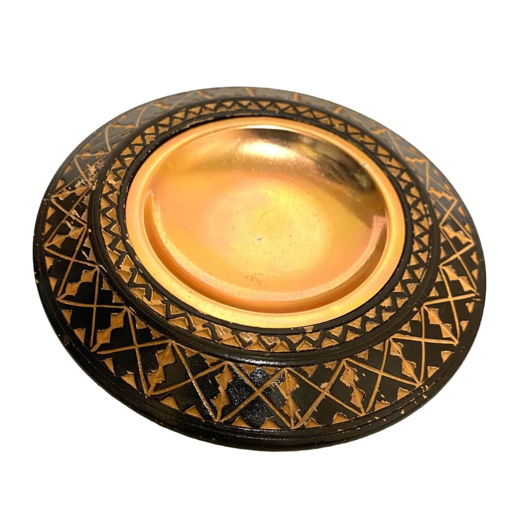 A Hand-Carved Tribal Ashtray with Copper Insert.