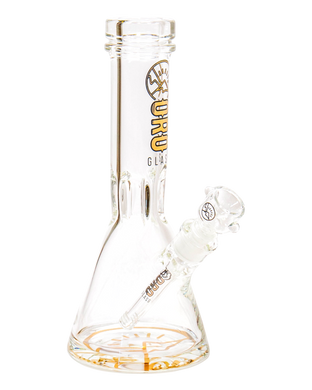 An Oro Glass Company 12 Karat Thick Beaker Water Pipe V2 with clear base logo.