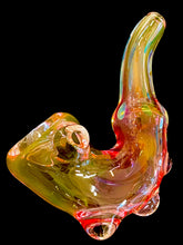 Load image into Gallery viewer, A Pink Inside Out Fumed Dot Sherlock Pipe in the dark.
